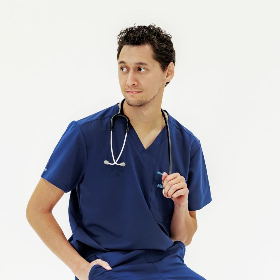 Durable navy V-neck scrub top designed for flexibility and movement throughout the day.