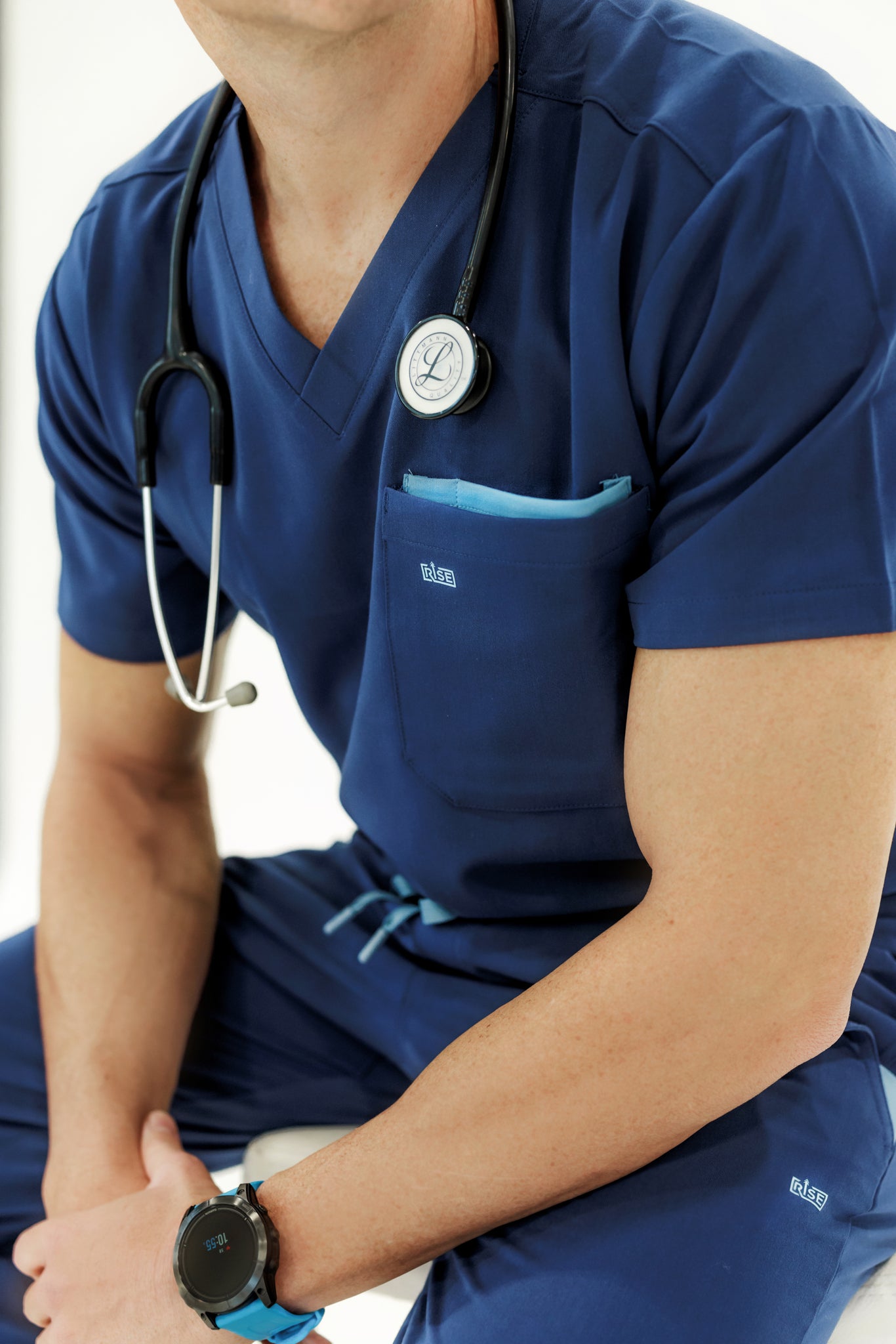 Comfortable and professional navy V-neck scrub top designed for busy healthcare workers.
