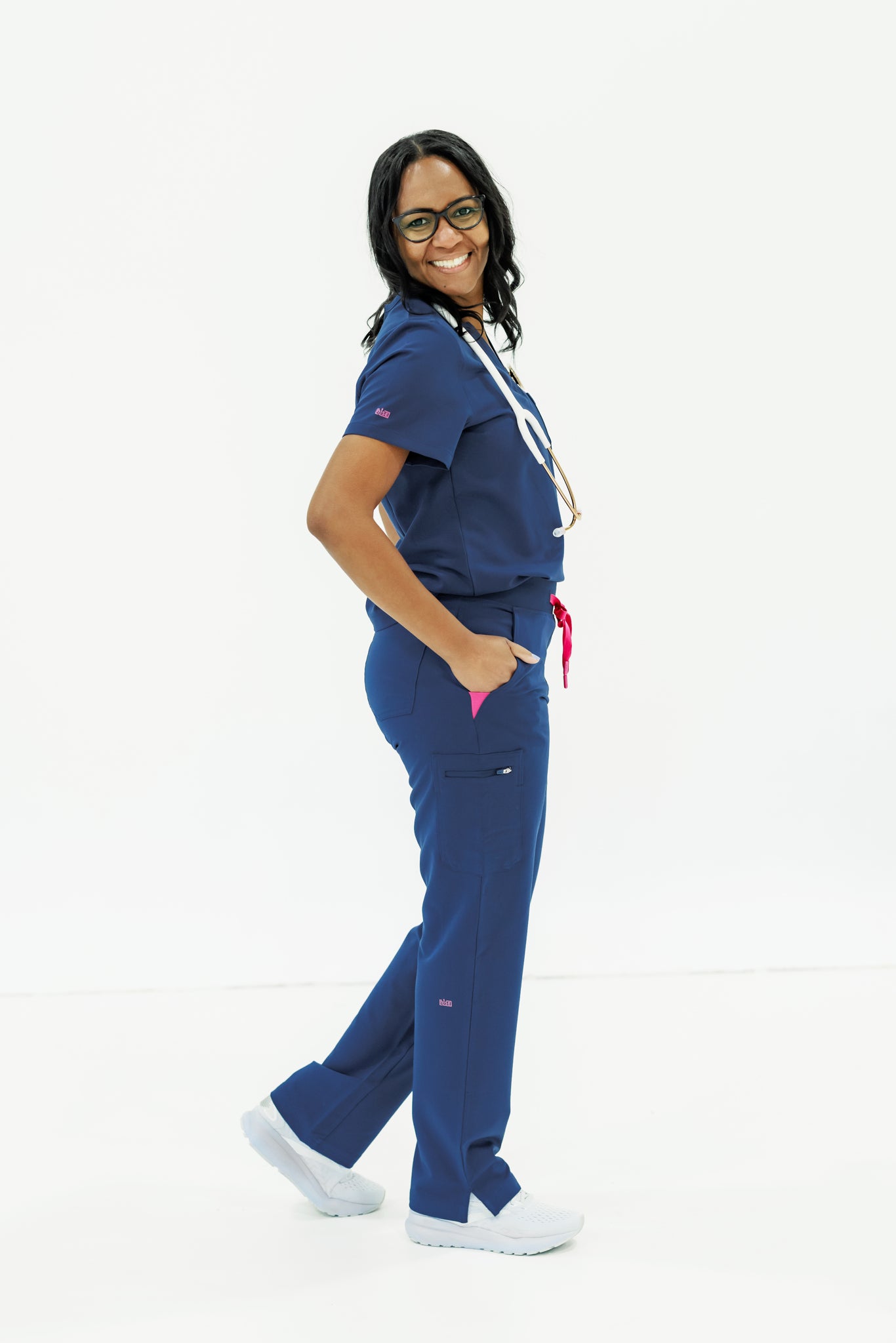Professional, comfortable navy crew neck scrub top designed for busy healthcare workers.