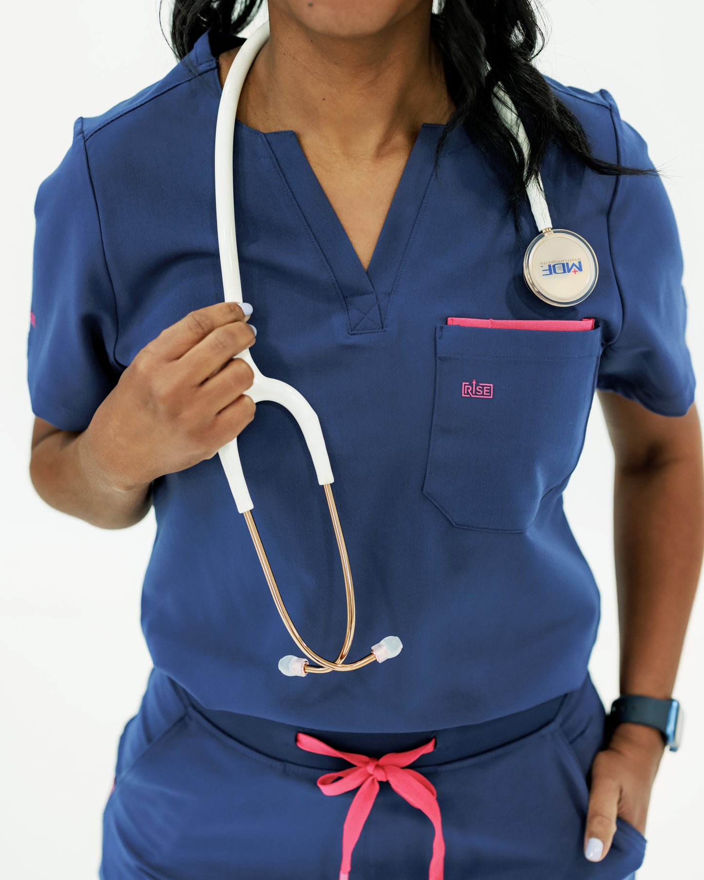 Modern navy crew neck scrub top offering comfort and breathability for medical workers.