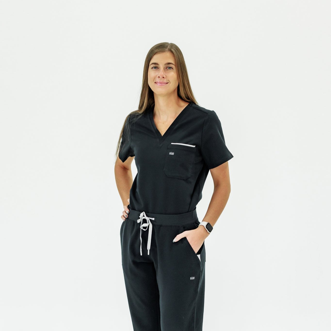 Classic black V-neck scrub top offering comfort and style for healthcare workers.