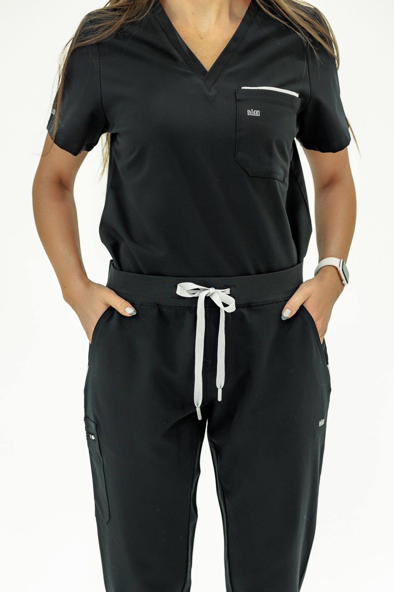 Sleek black V-neck scrub top designed for flexibility and comfort during long shifts.