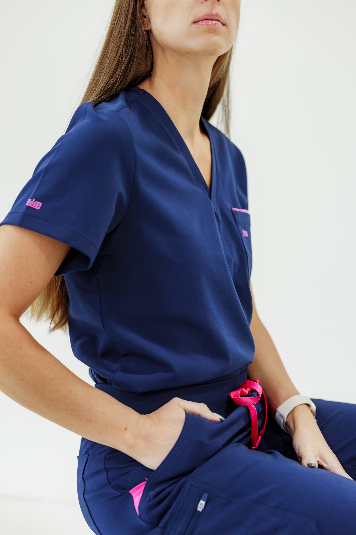 Comfortable and functional navy V-neck scrub top designed for long shifts.