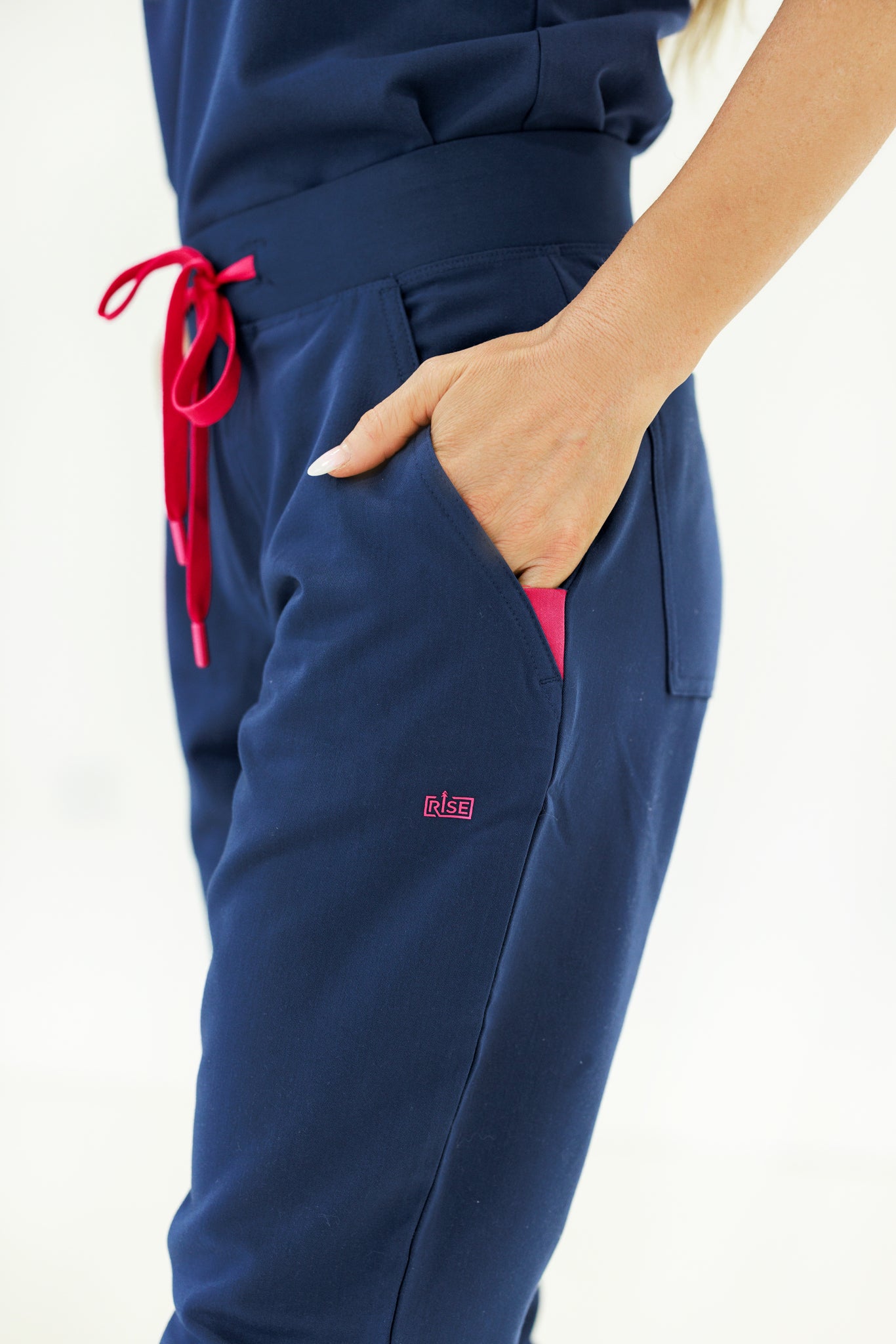 Flexible and breathable navy jogger scrub pants perfect for long shifts in medical settings.
