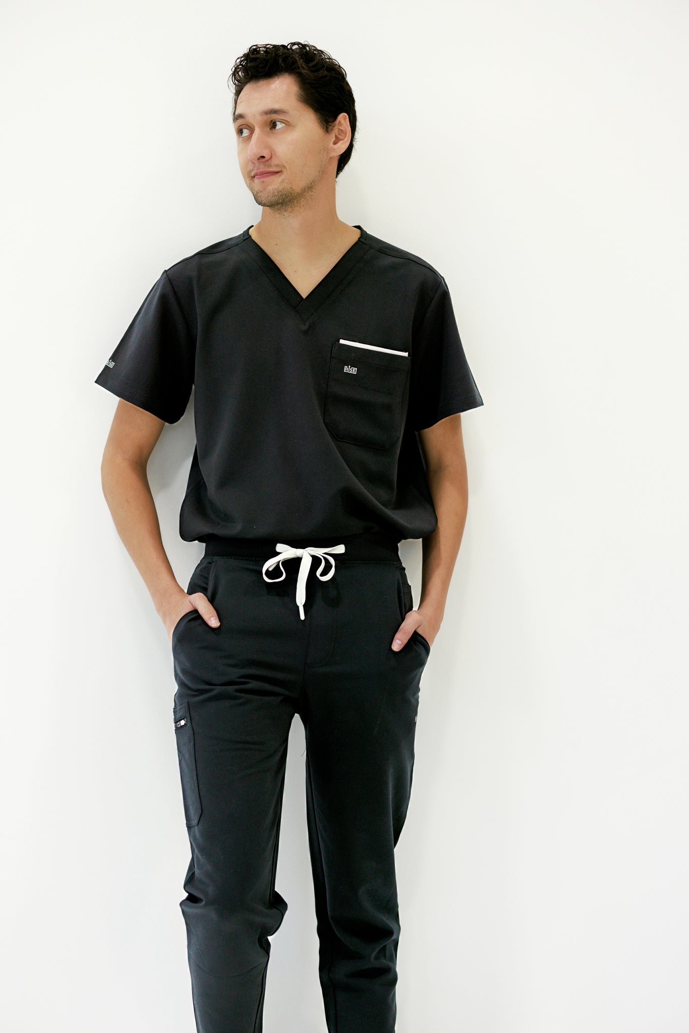 Stylish black jogger scrub pant with a modern design, perfect for healthcare environments.