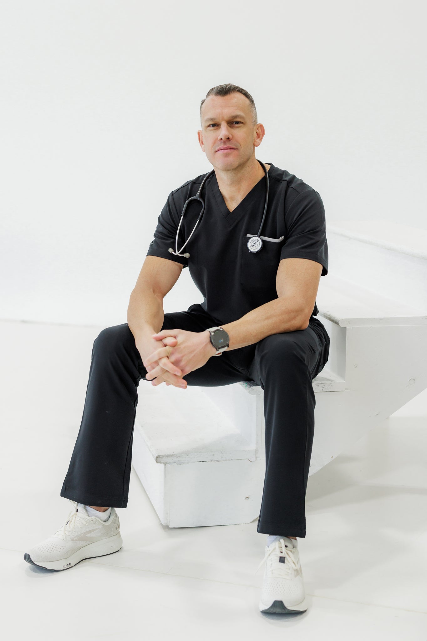 Comfortable black V-neck scrub top providing flexibility and durability for long shifts.