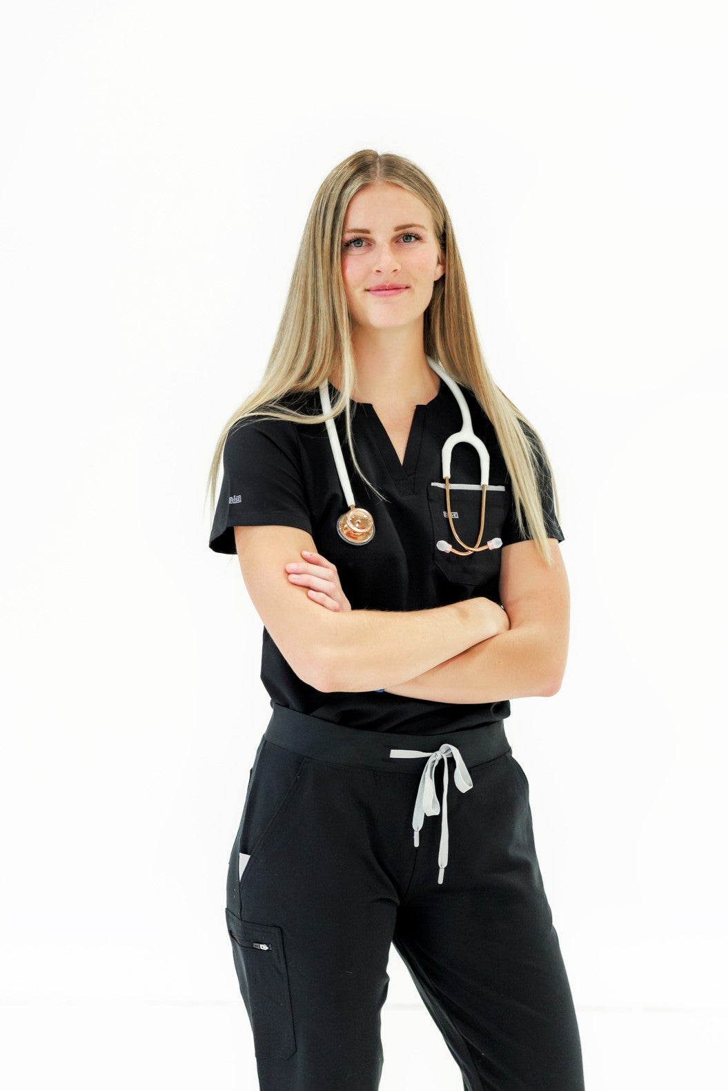 Comfortable black crew neck scrub top offering all-day comfort for healthcare professionals.