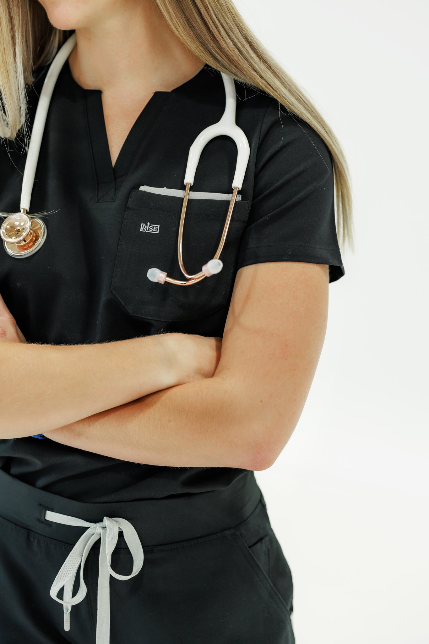 Classic black scrub top with a crew neck, designed for durability and comfort.
