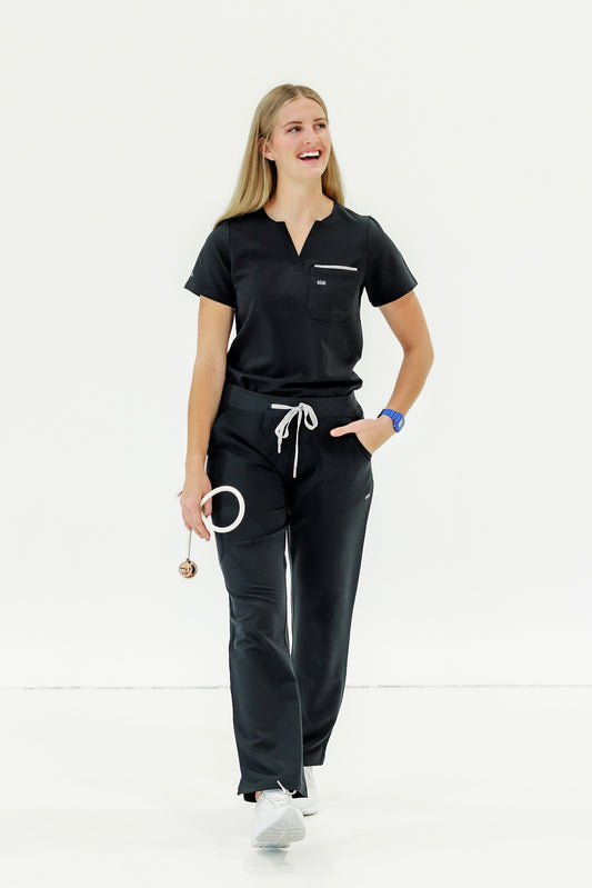 Stylish black scrub top with a classic crew neck, perfect for busy healthcare workers.